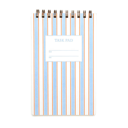 Top-spiral notebook. Light blue, white, and orange striped patterned cover. 