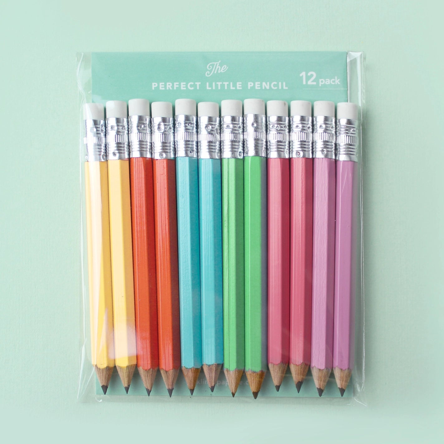 Multicolor set of small sharpened pencils in their packaging. 