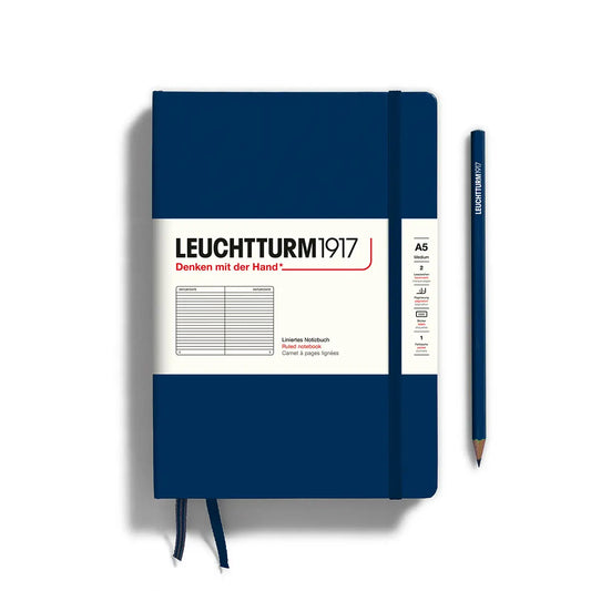 Navy blue notebook with white label featuring 'Leuchtturm1917' on a white background