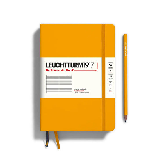 Notebook with mustard yellow cover. White label with black text reading "leuctturm1917"