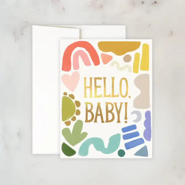 White greeting card with multicolor abstract shapes. Gold text: hello, baby! 