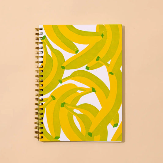 Notebook with banana pattern on a beige background
