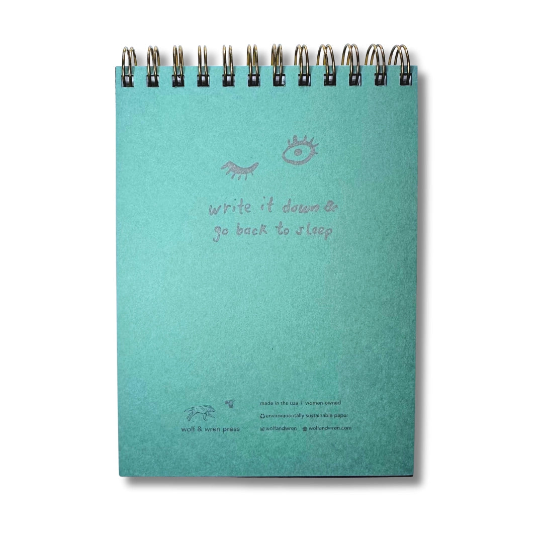 Back cover. Teal notebook with text and illustrations on a white background