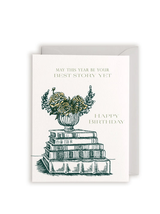 Greeting card with floral and book design and text 