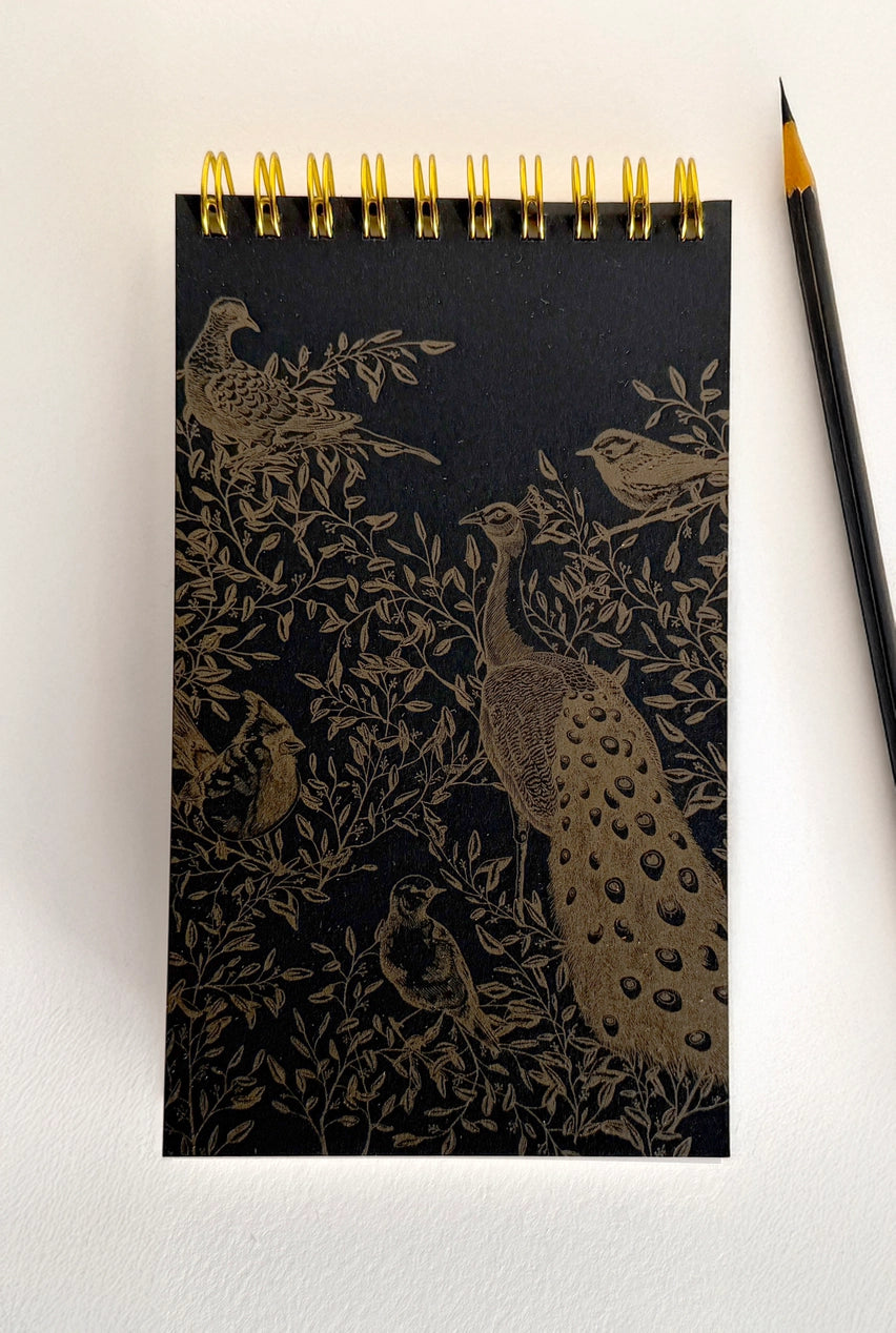 Notebook with peacock design on cover