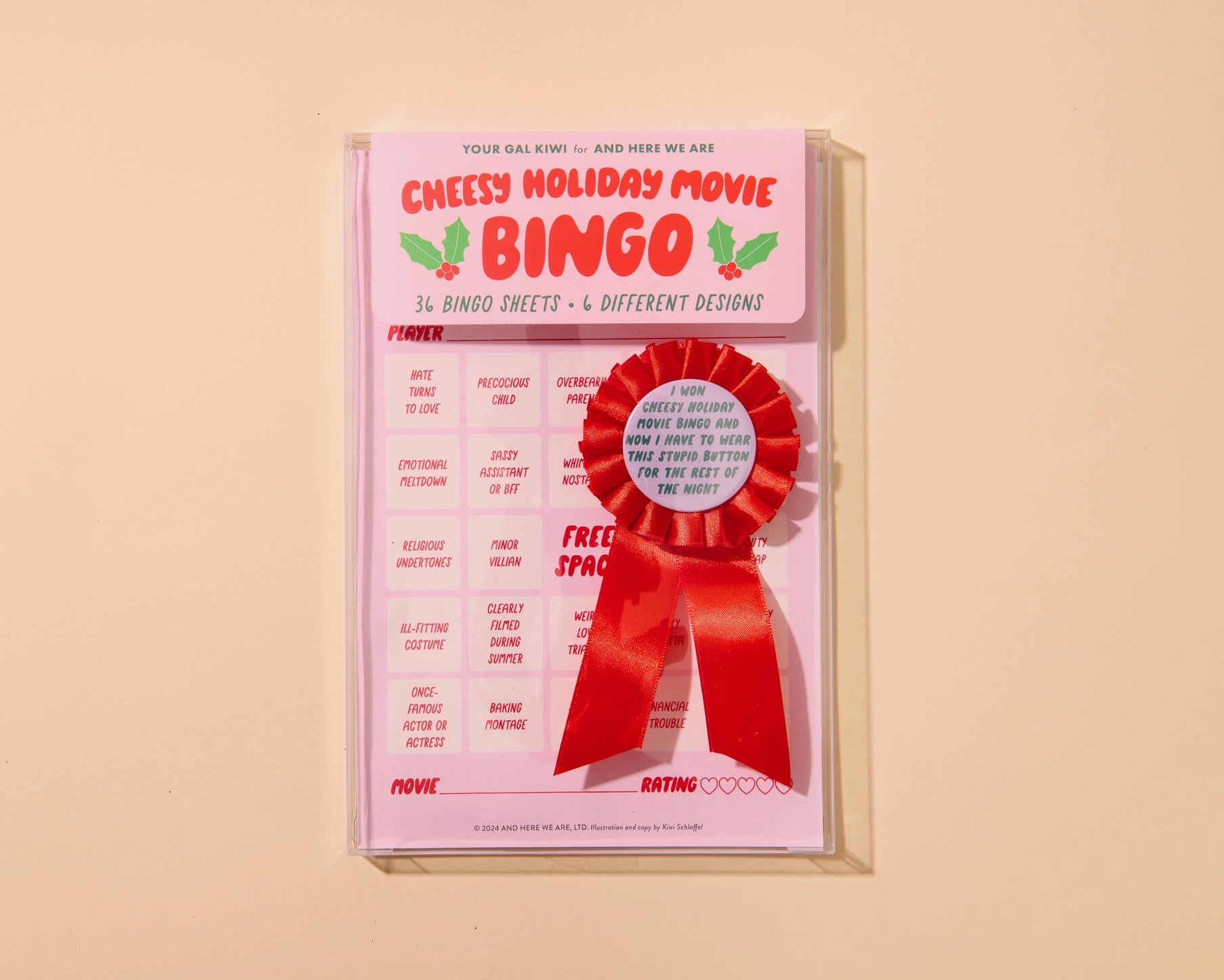 Cheesy Holiday Movie Bingo game with a red ribbon on a beige background