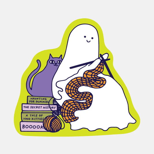 Die-cut sticker of a ghost with a cat, books, and knitting yarn