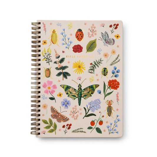Spiral bound notebook with colorful flora and fauna illustrations 