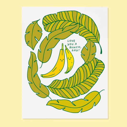 White greeting card featuring illustrations of bananas and leaves with 'Love you a bunch, Dad!' text 