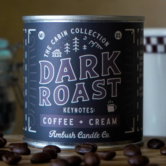 Candle can labeled 'Dark Roast' with coffee beans around it.