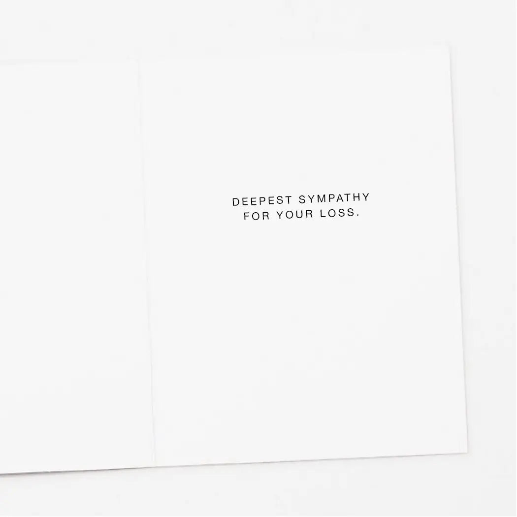 White card with black text 'DEEPEST SYMPATHY FOR YOUR LOSS.'