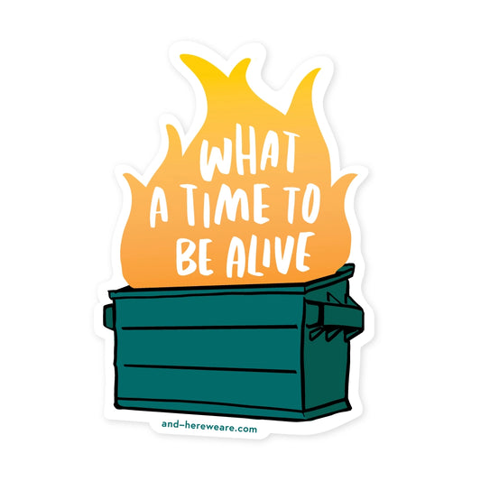 Die-cut sticker in the shape of a dumpster fire. White text in fire: what a time to be alive 