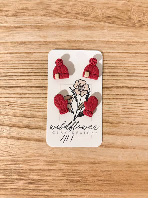 Stud earrings in the shape of a stocking cap and mittens 