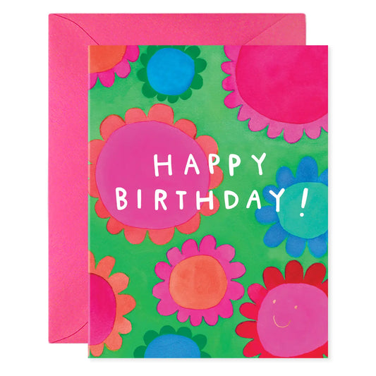 Birthday card with colorful flower illustrations. White text: happy birthday! 