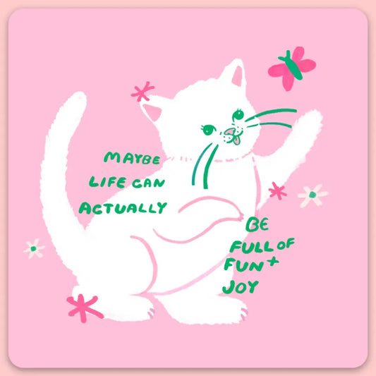 Pink square-shaped sticker featuring an illustration of a white cat and pink butterfly. Green text reads "maybe life can actually be full of fun + joy" 