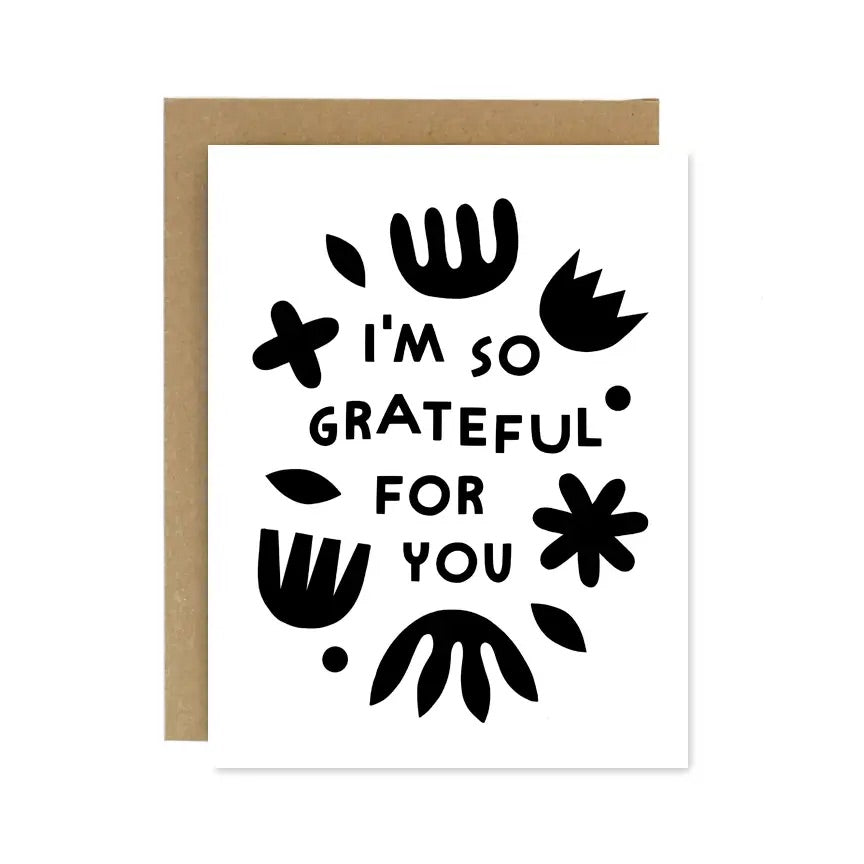White greeting card with a black text that reads 'I'm so grateful for you' surrounded by abstract shapes