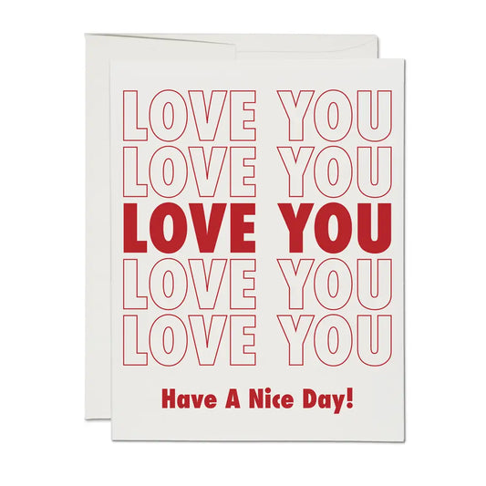 Greeting card with 'LOVE YOU' text repeated in red on a white background