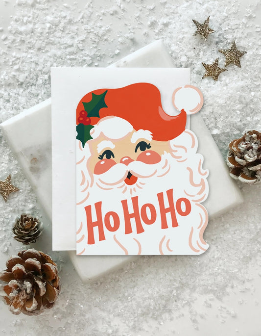 Die-cut greeting card in shape of Santa. Ho ho ho in red text 