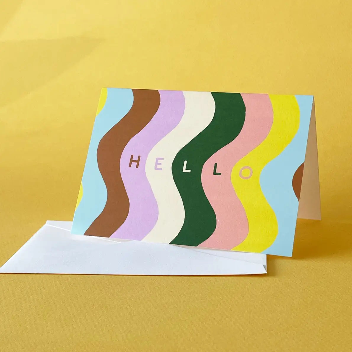 White card with blue, brown, lavender, white, green, coral, and yellow swirls. Text reads "hello"