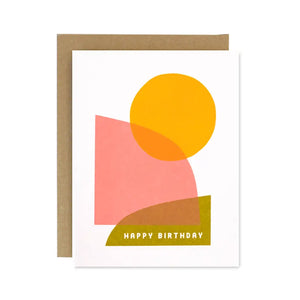 white card with overlapping yellow, pink, and green shapes. white text reads "happy birthday"