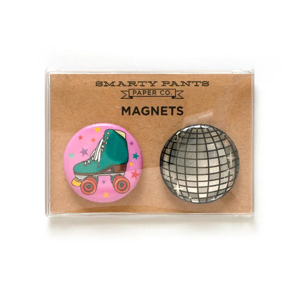 Set of two round magnets in a clear plastic box with brown kraft paper packaging. Black text reads "Smarty Pants Paper Co Magnets"