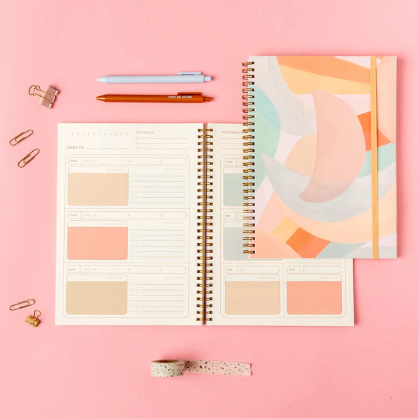 Flat lay showing planner cover and inside view