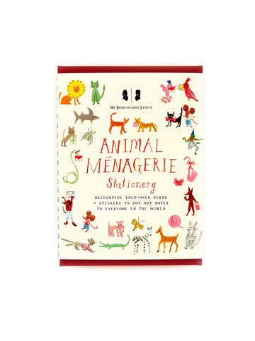Front cover packaging. Cream cover with red text reading “animal menagerie stationery.” Illustrations of various animals 