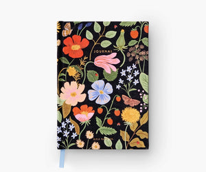 Black notebook cover decorated with red, pink, blue, and yellow flowers. Gold text reads "journal" 