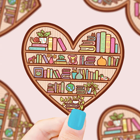 Heart shaped sticker with brown outline featuring four bookshelves full of books and plants