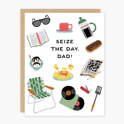 White card with illustrations of the following: sunglasses, book, ice cream, chair, vinyl, nachos, crossword, donut, coffee. Black text reads "seize the day, dad!" 