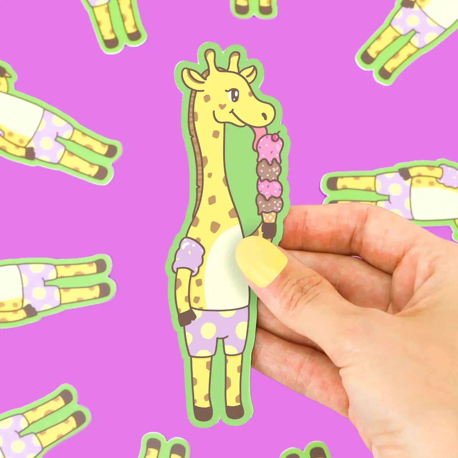 Die-cut sticker of yellow giraffe wearing purple swim trunks and floaties licking an ice cream cone with four scoops of ice cream. 