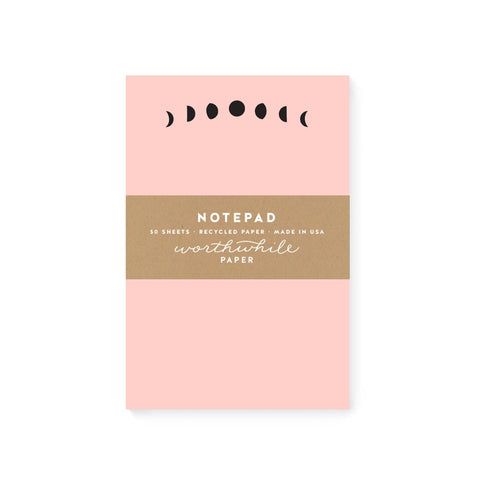 Pink notepad with black moon phases header