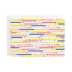 White card with repeating illustration of yellow, red, and blue pencils