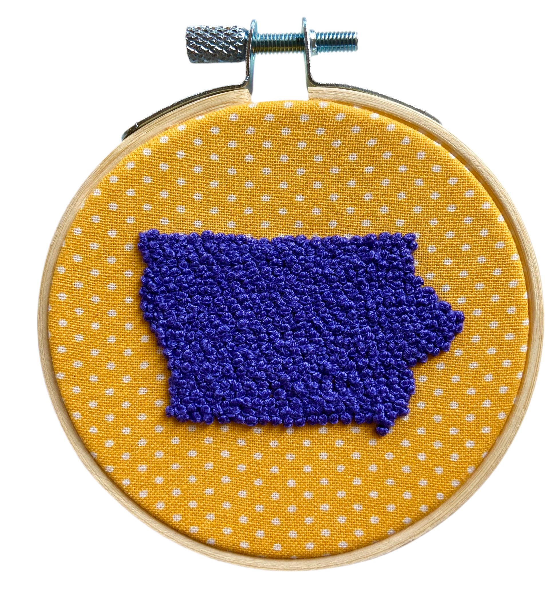 Embroidery in hoop. Yellow and white fabric with purple Iowa 