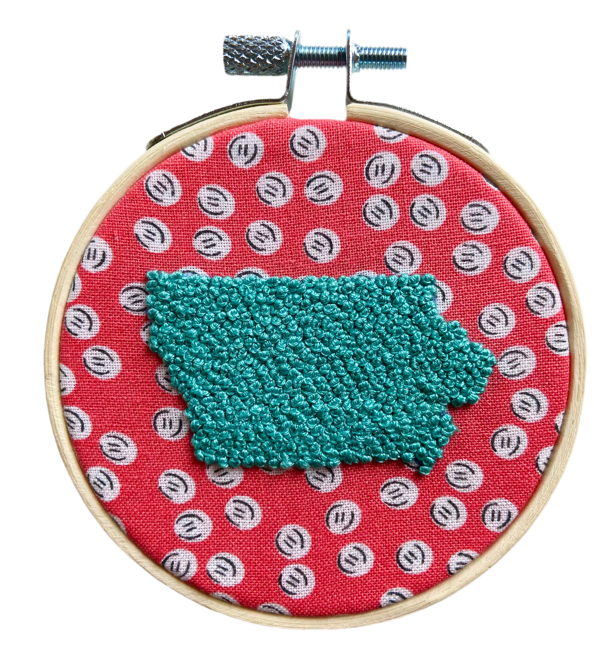 Embroidery in hoop. Pink fabric with white dots. Turquoise Iowa 