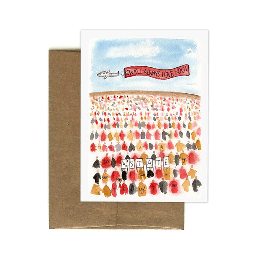 White greeting card with watercolor design of an iowa state football game. Text: iowa’ll always love you and state 