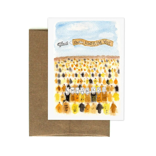 Greeting card with watercolor design of an Iowa Hawkeye football game and text: “Iowa’ll always love you and the hawks” 
