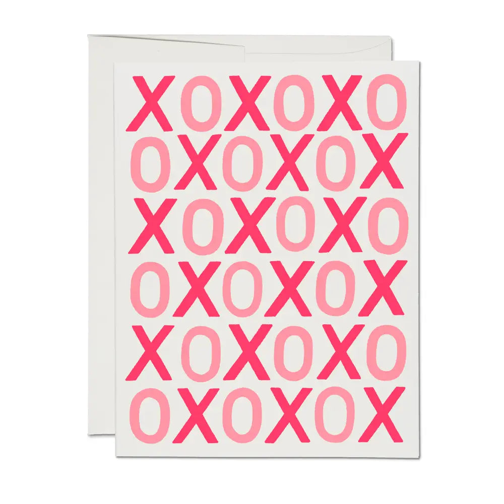 Greeting card with pink 'XOXO' pattern on a white background