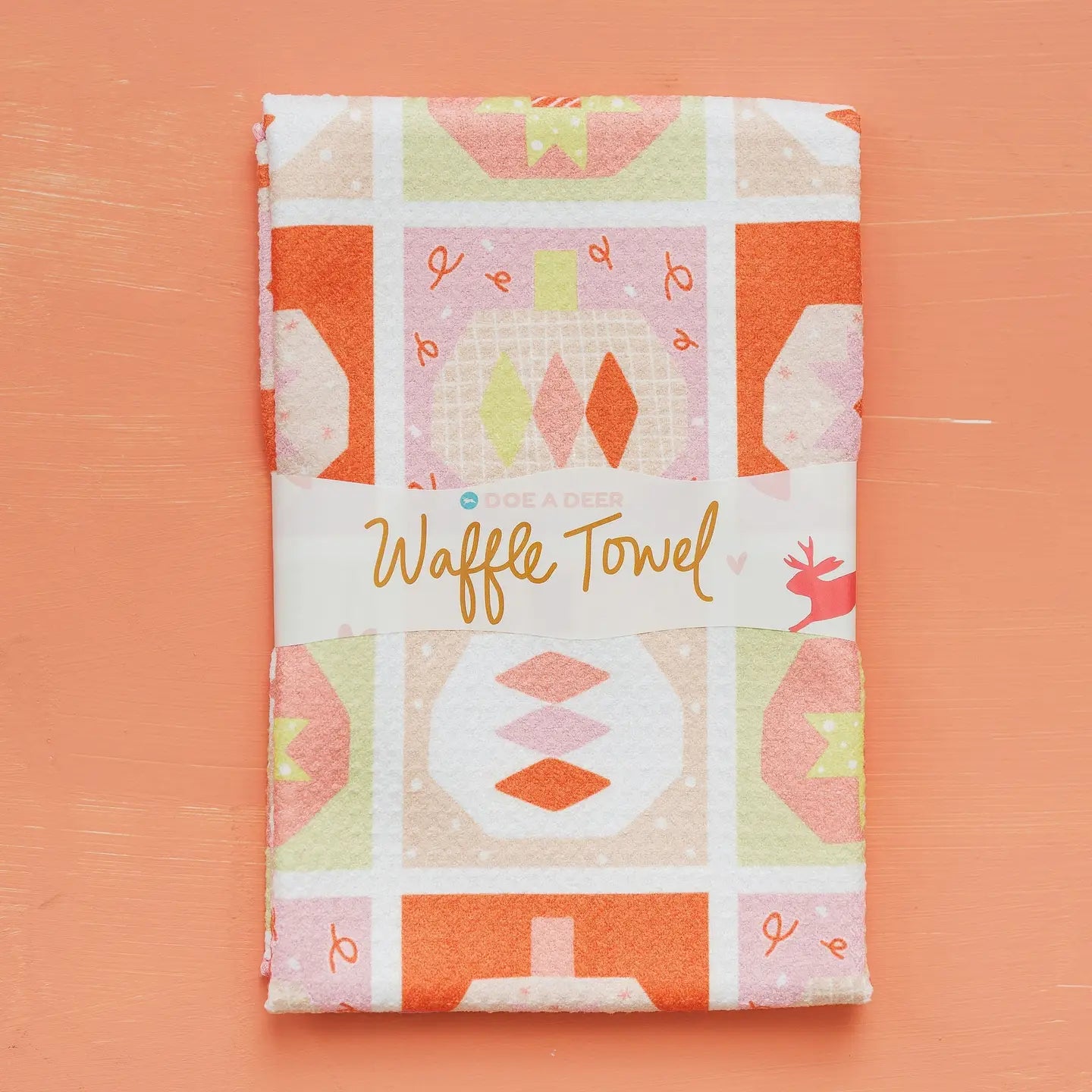 Waffle towel with pumpkin pattern on a peach background