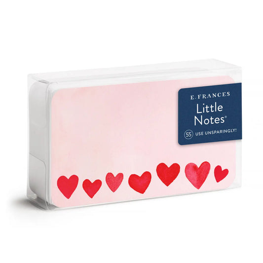 Pack of Little Notes with red hearts on a pink flat notecard 
