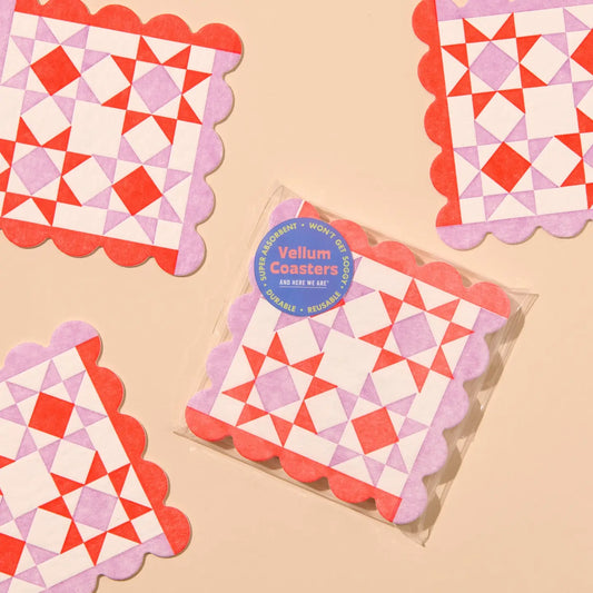 Packaged coasters with geometric quilt pattern on a beige background