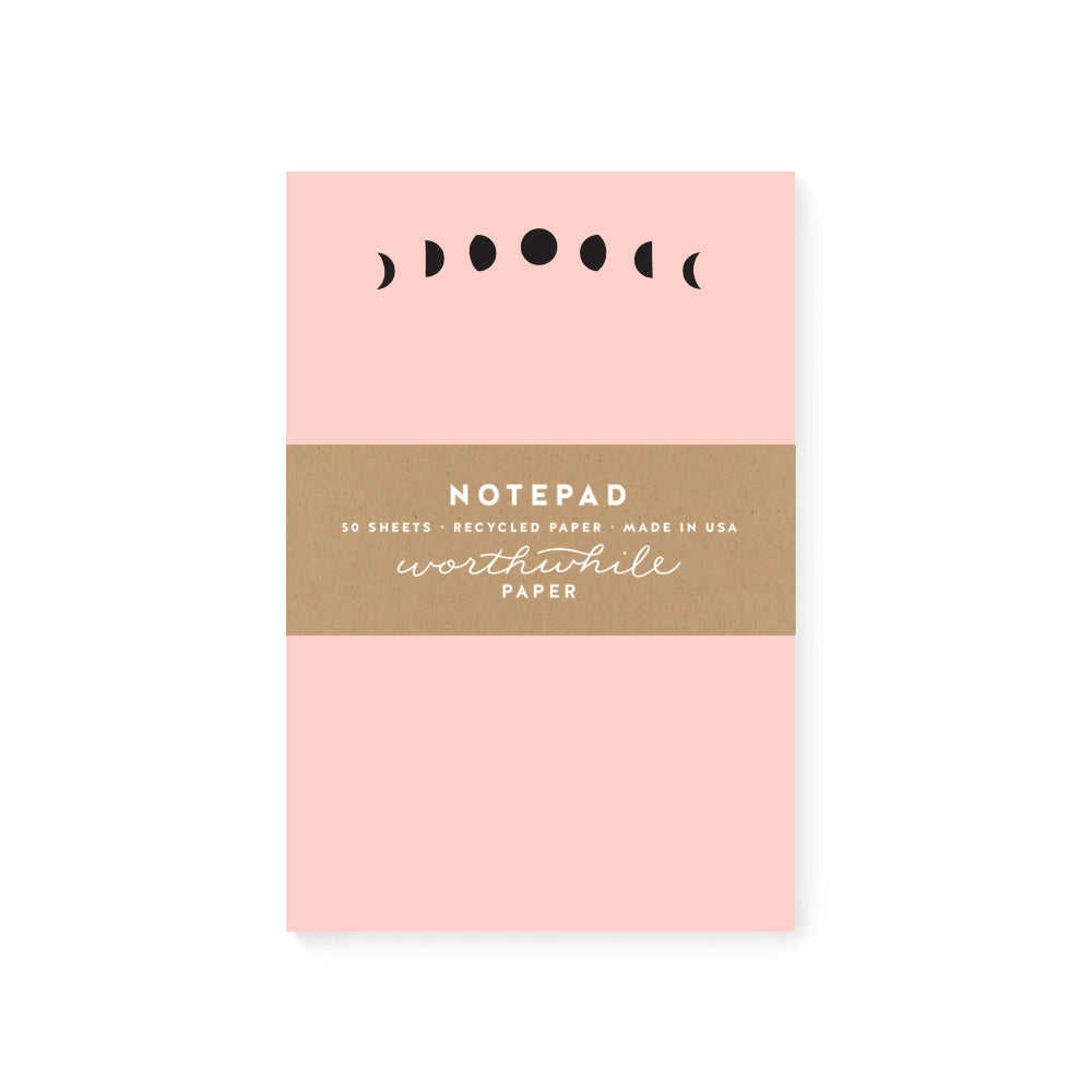 Pink notepad with black moon phases header