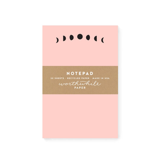 Pink notepad with black moon phases header
