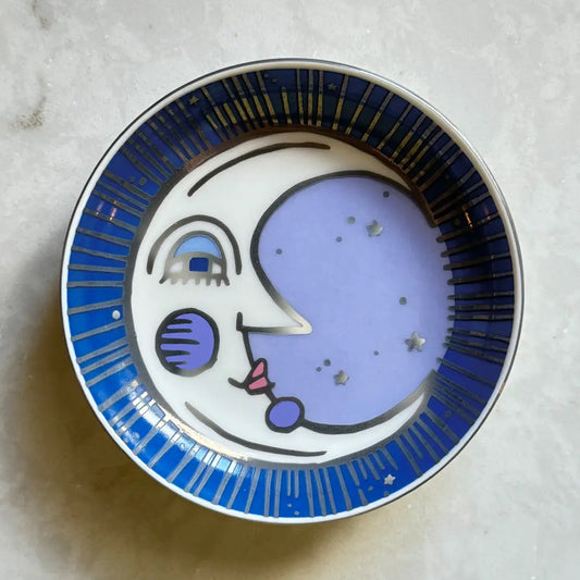 Decorative trinket dish with a moon face design