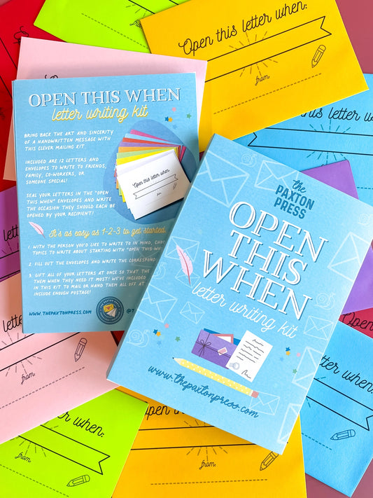Colorful letter writing kit with envelopes and stationery items on a multicolored background