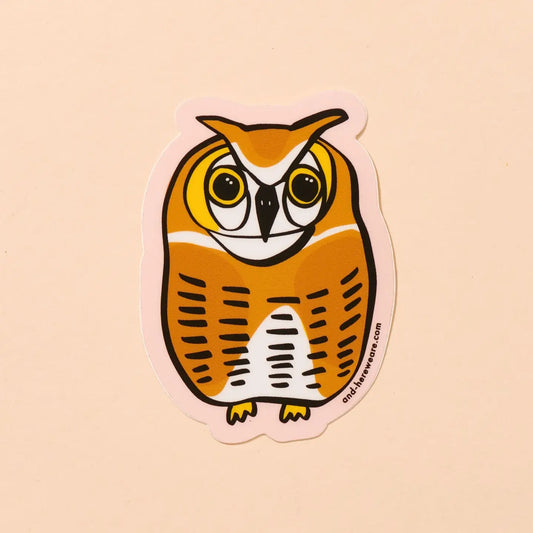 Die-cut sticker in the shape of an owl. Orange, yellow, white color. 