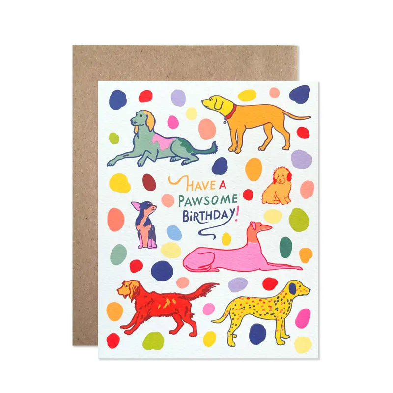 White greeting card with colorful dog illustrations and 'Have a Pawsome Birthday!' text