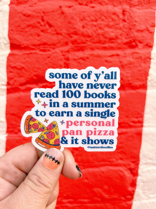 A die-cut sticker held against a red background. The text on the sticker includes a quote about summer reading and a personal pan pizza.