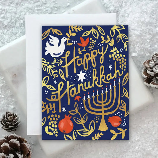 Hanukkah card with Menorah, dove, and pomegranate on a navy background