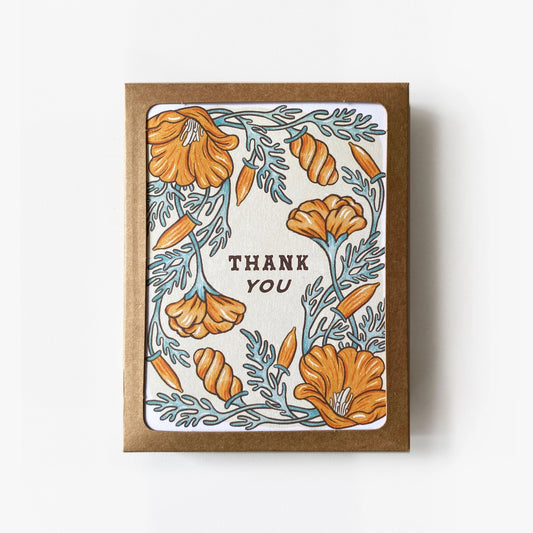 Greeting card with orange poppy design and 'Thank You' text  in a brown Kraft box 